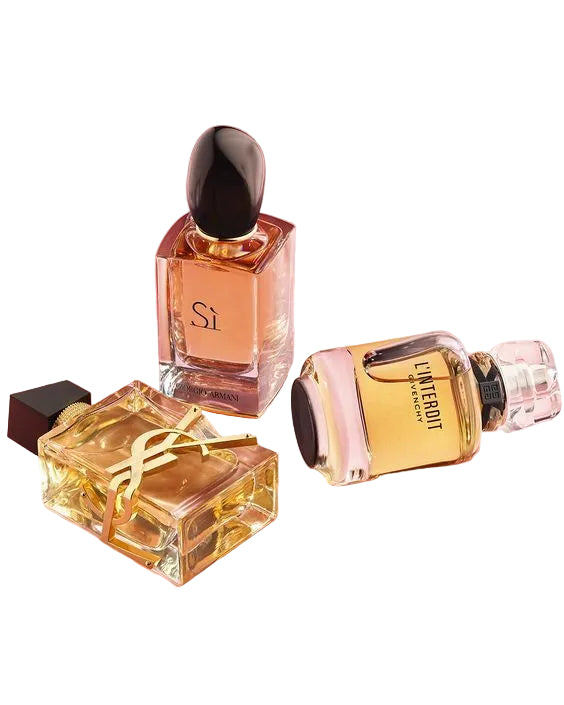 Three perfume bottles on a pink background